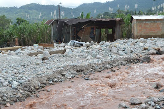 Destroyed Building by Stream in Village